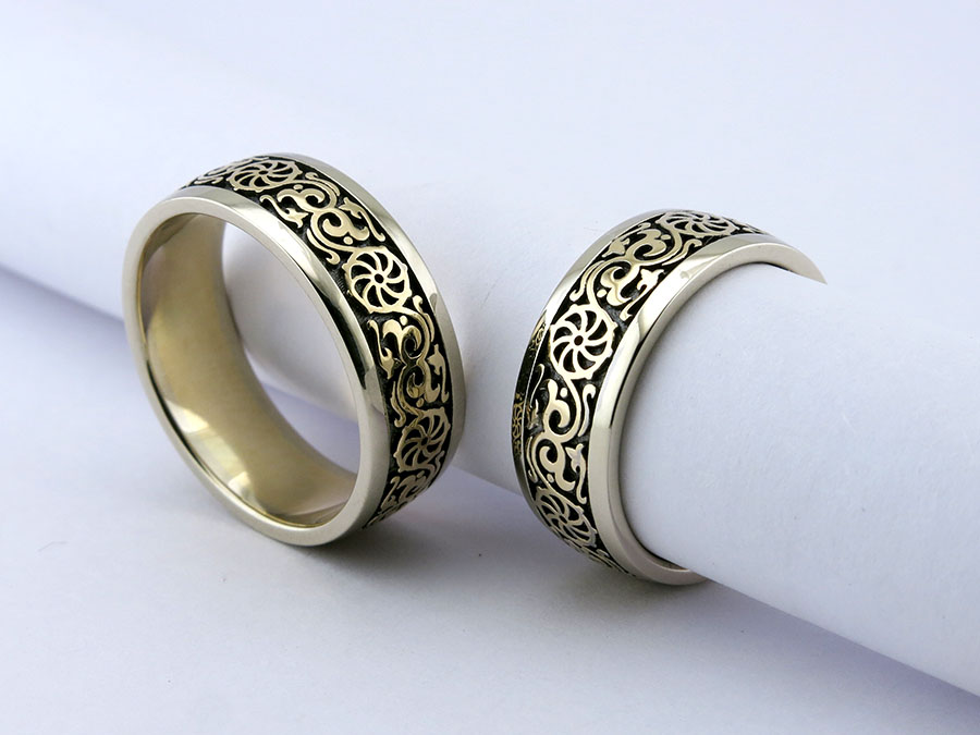 Обручальные кольца "Коловрат" из белого и желтого золота