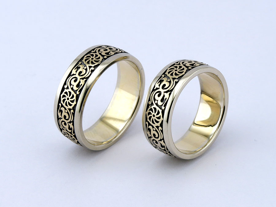 Обручальные кольца "Коловрат" из белого и желтого золота