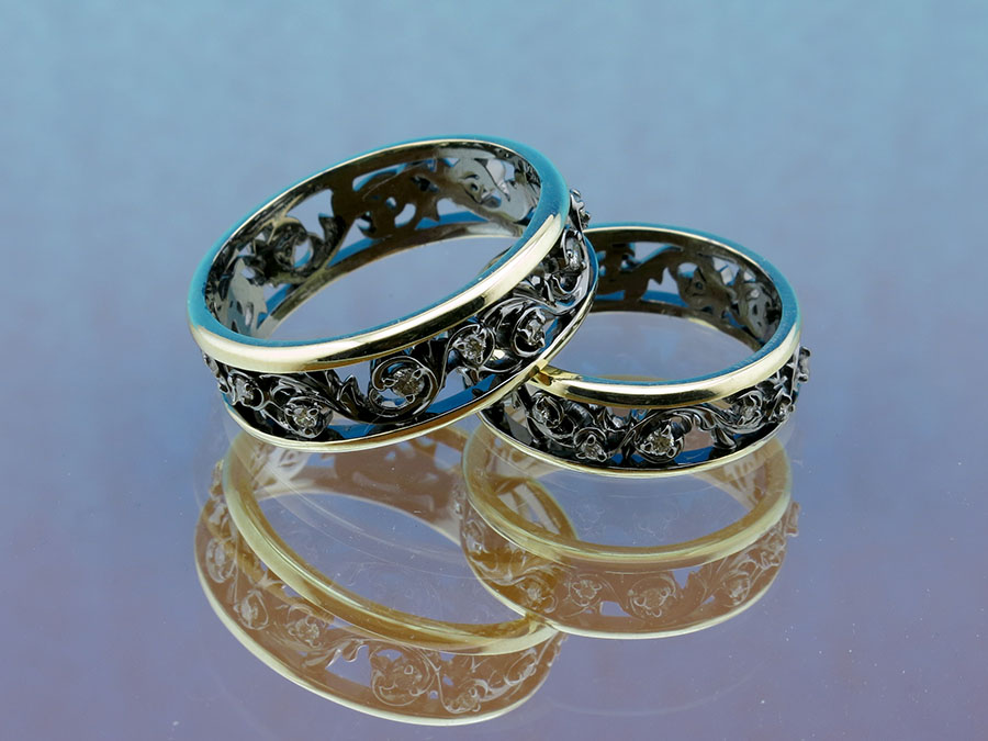 Обручальные кольца из золота 750 пробы с бриллиантами и черным родием